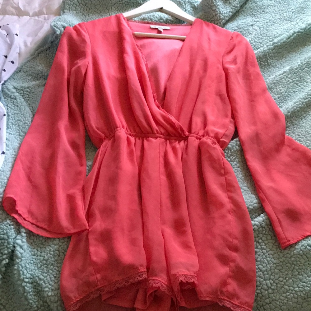 Peachy pink long sleeve romper!